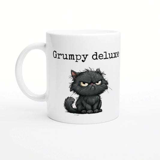 Product mockup: white ceramic mug featuring a grumpy cartoon black cat and the text Grumpy deluxe.