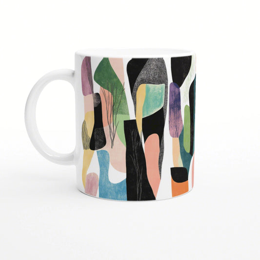 Product image: white ceramic mug with an abstract, colorful pattern of green, pink, blue and black shapes.