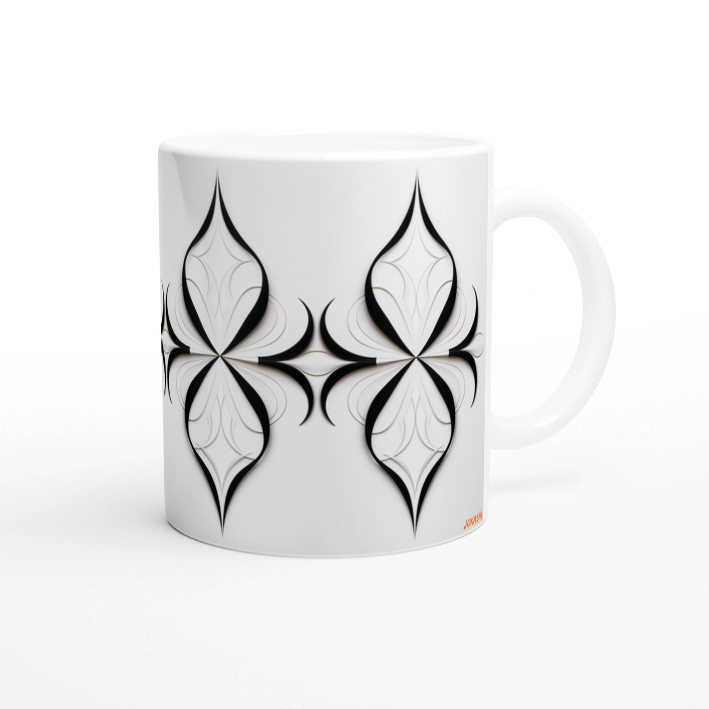 White ceramic mug with a bold black symmetric four-petal geometric motif wrapping around the side.