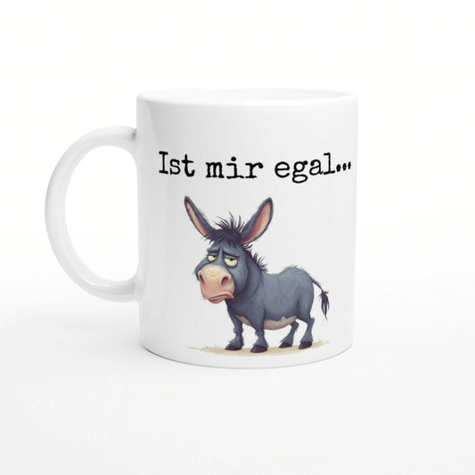 White ceramic mug with a cartoon blue-gray donkey and the phrase 'Ist mir egal...' in black typewriter-style text.