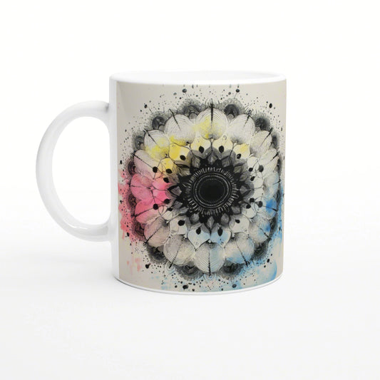 White ceramic mug featuring a large circular mandala in black and gray with pastel pink, yellow, and blue accents.