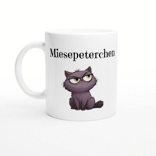 White ceramic mug featuring a purple grumpy kitten and the text Miesepeterchen in black above it.