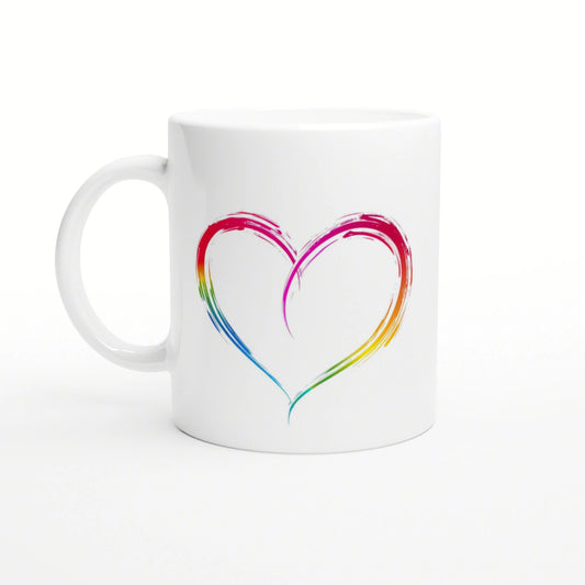 White ceramic mug with a rainbow brushstroke heart design, presented as a product mockup.