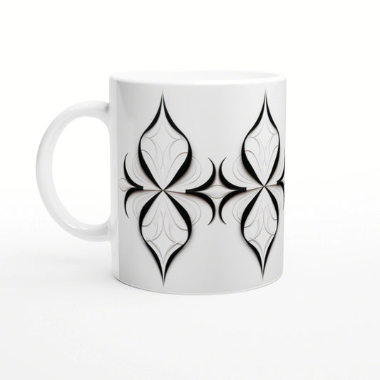 White ceramic mug featuring a repeating black geometric quatrefoil motif; product design mockup.