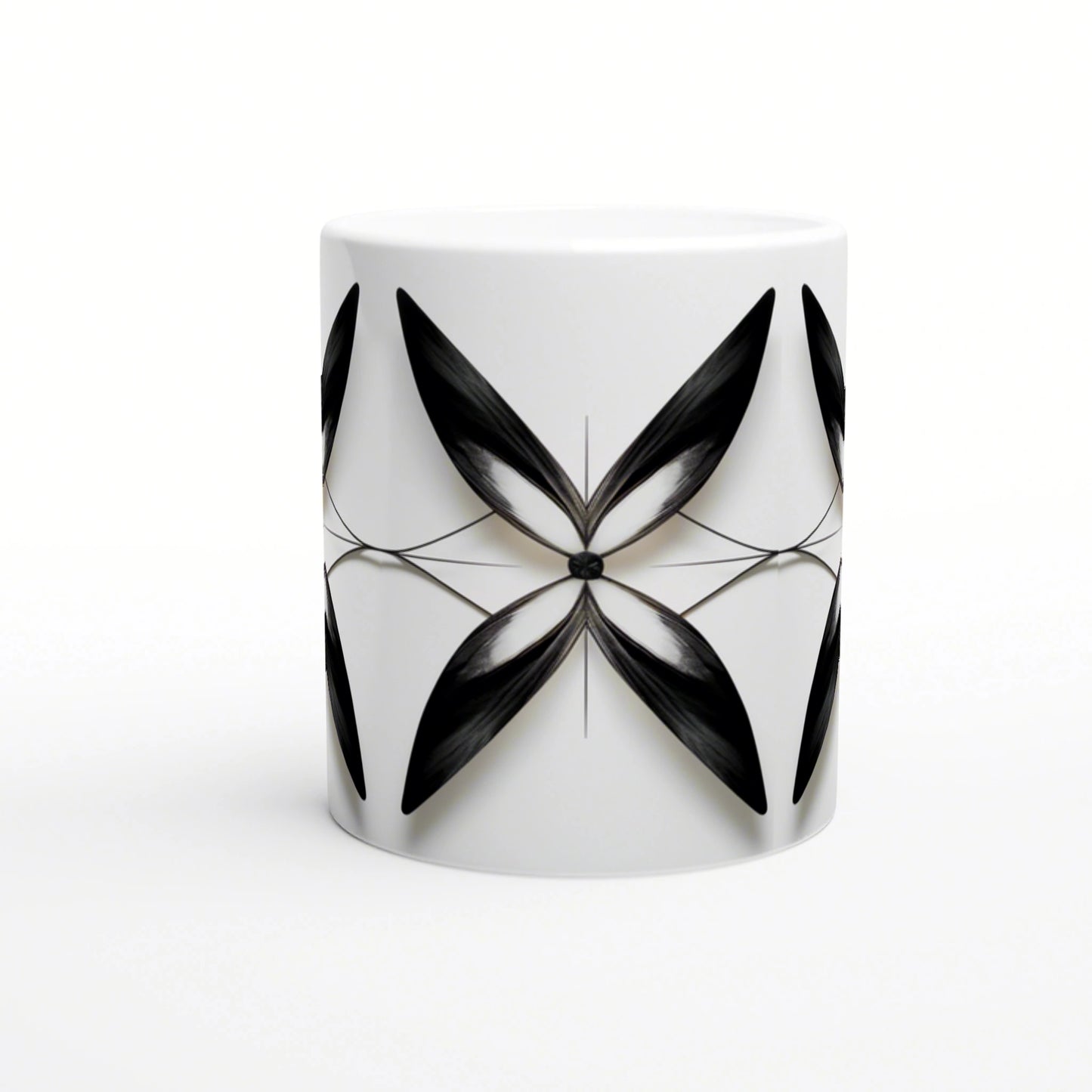 White ceramic mug with a symmetric black abstract floral motif radiating from a central point.
