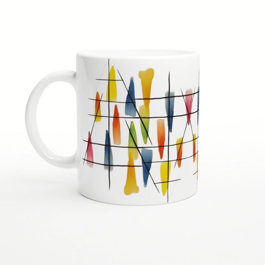 Product mockup: white mug with abstract watercolor strokes in yellow, blue, orange and red, crossed by black angled lines.