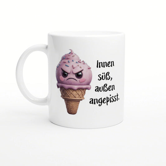 White mug featuring a pink, angry ice-cream cone with sprinkles and the German caption 'Innen süß, außen angepisst'.