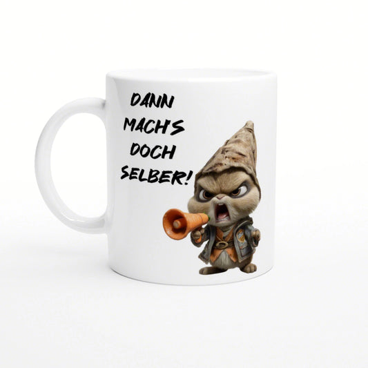 White ceramic mug mockup featuring a cartoon character shouting into a megaphone and the German slogan Dann mach's doch selber!