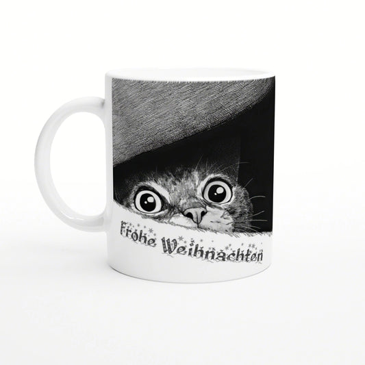 White ceramic mug featuring a black-and-white cat peeking from under a grey hat with the text Frohe Weihnachten.