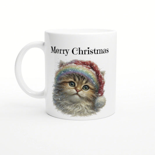 White mug with a cute kitten wearing a Santa hat and rainbow scarf, Merry Christmas text.
