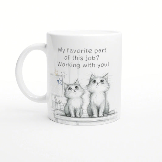 White mug featuring a pencil sketch of two kittens and the slogan 'My favorite part of this job? Working with you!'