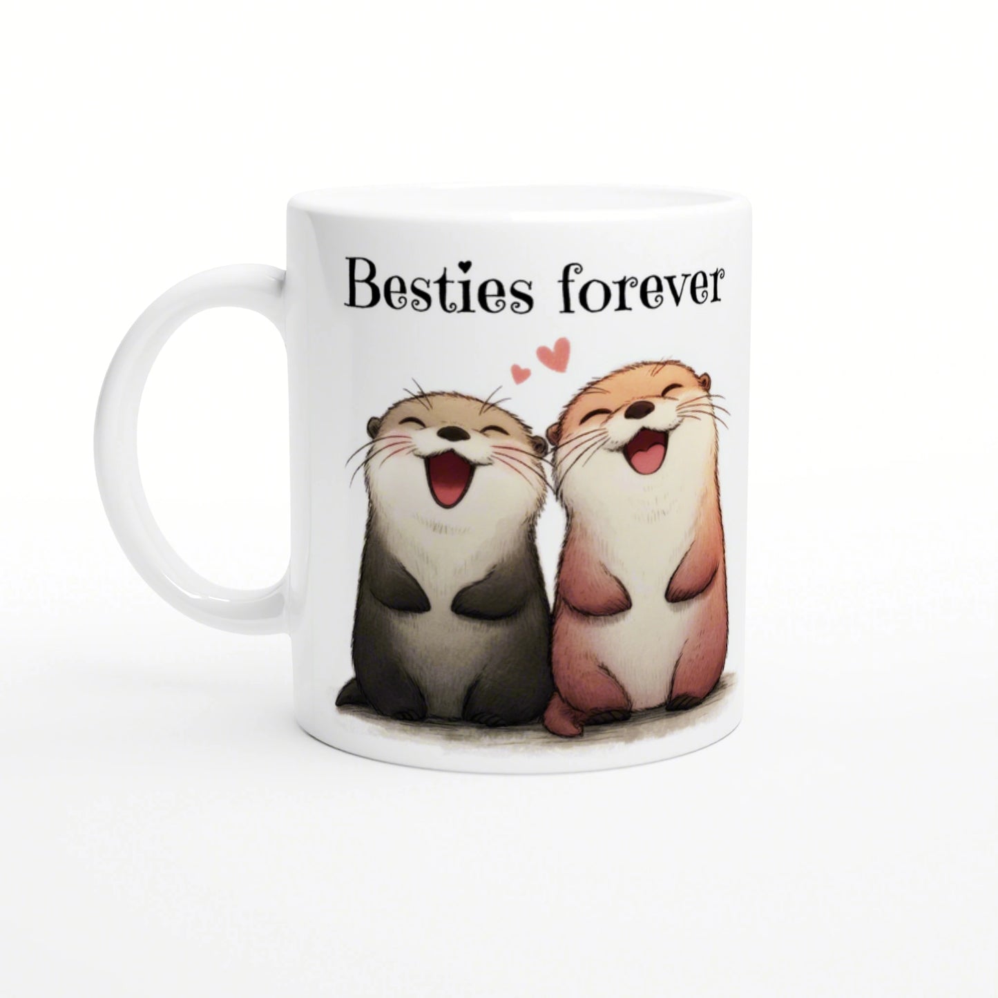 White ceramic mug featuring two smiling cartoon otters side by side, with the caption 'Besties forever' and small pink hearts.