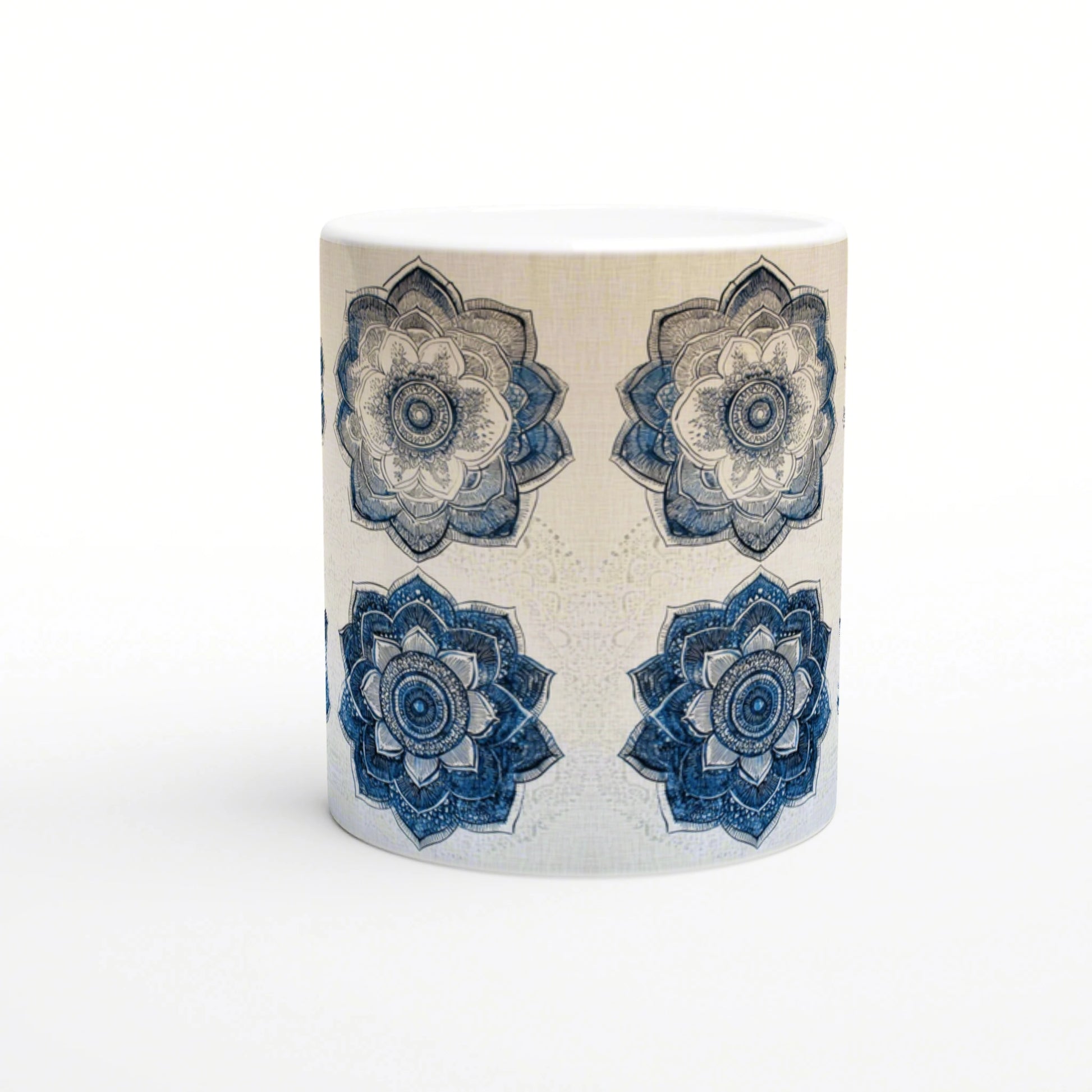 Ceramic mug mockup: white mug with a beige textured background and four blue mandala flowers around its body.