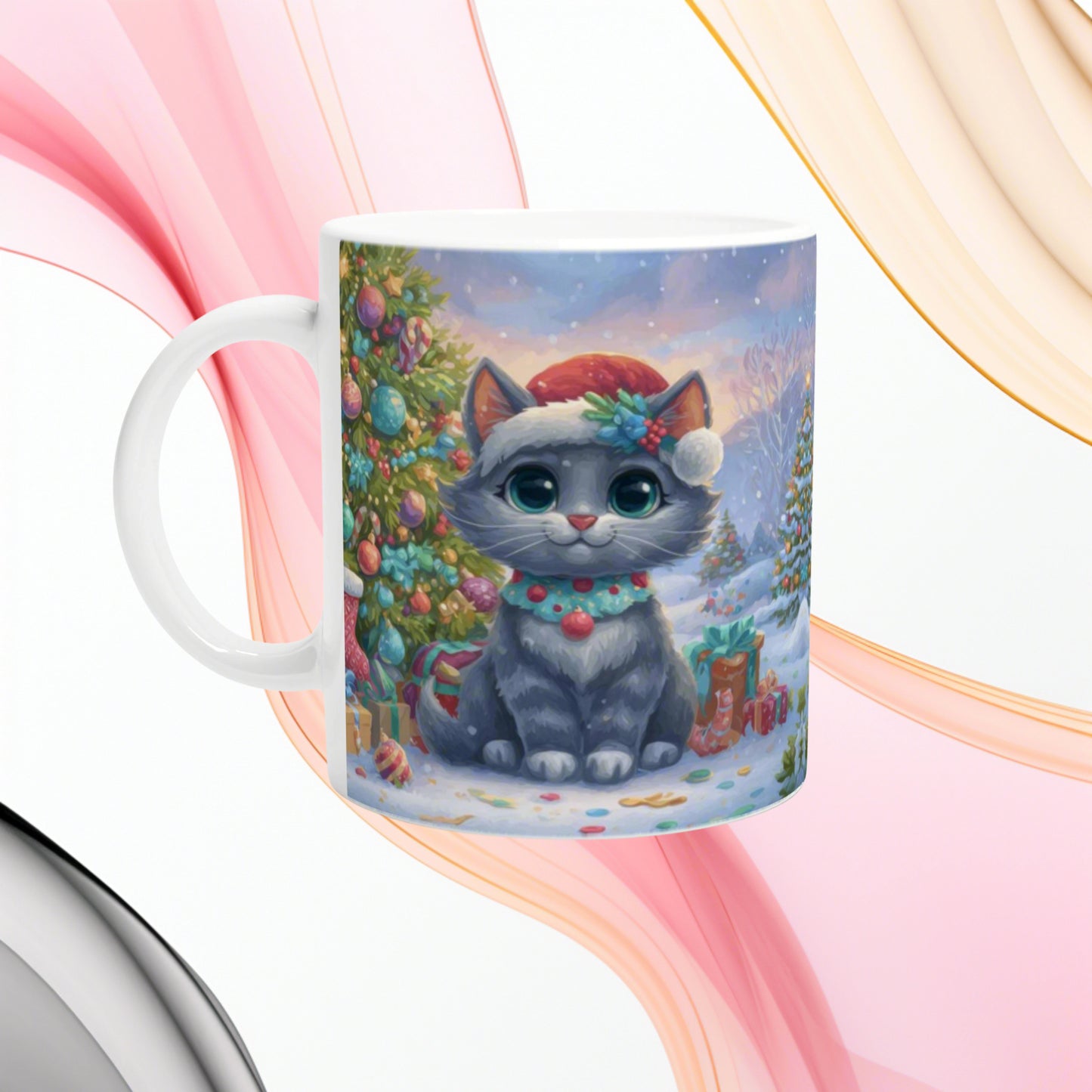 Ceramic mug featuring a cute gray kitten in a Santa hat in a snowy Christmas scene with a decorated tree.