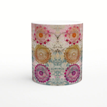 Ceramic mug mockup with a wraparound colorful mandala pattern in pink, orange, purple and teal.