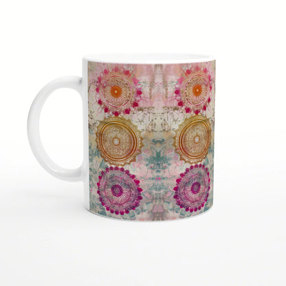 Colorful mandala mug mockup with pink, orange, teal and purple circular patterns.
