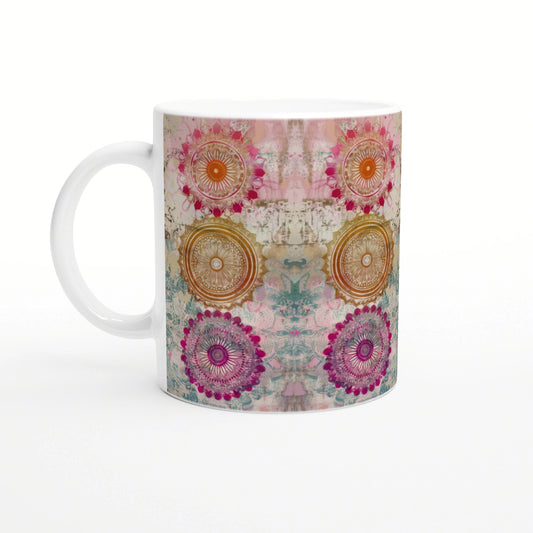 Colorful mandala mug mockup with pink, orange, teal and purple circular patterns.