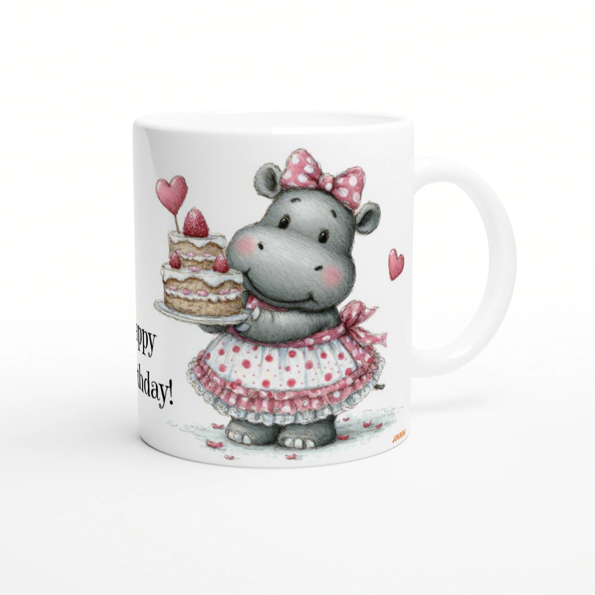 Cute hippo in a pink polka-dot dress and bow holding a layered birthday cake on a white mug.