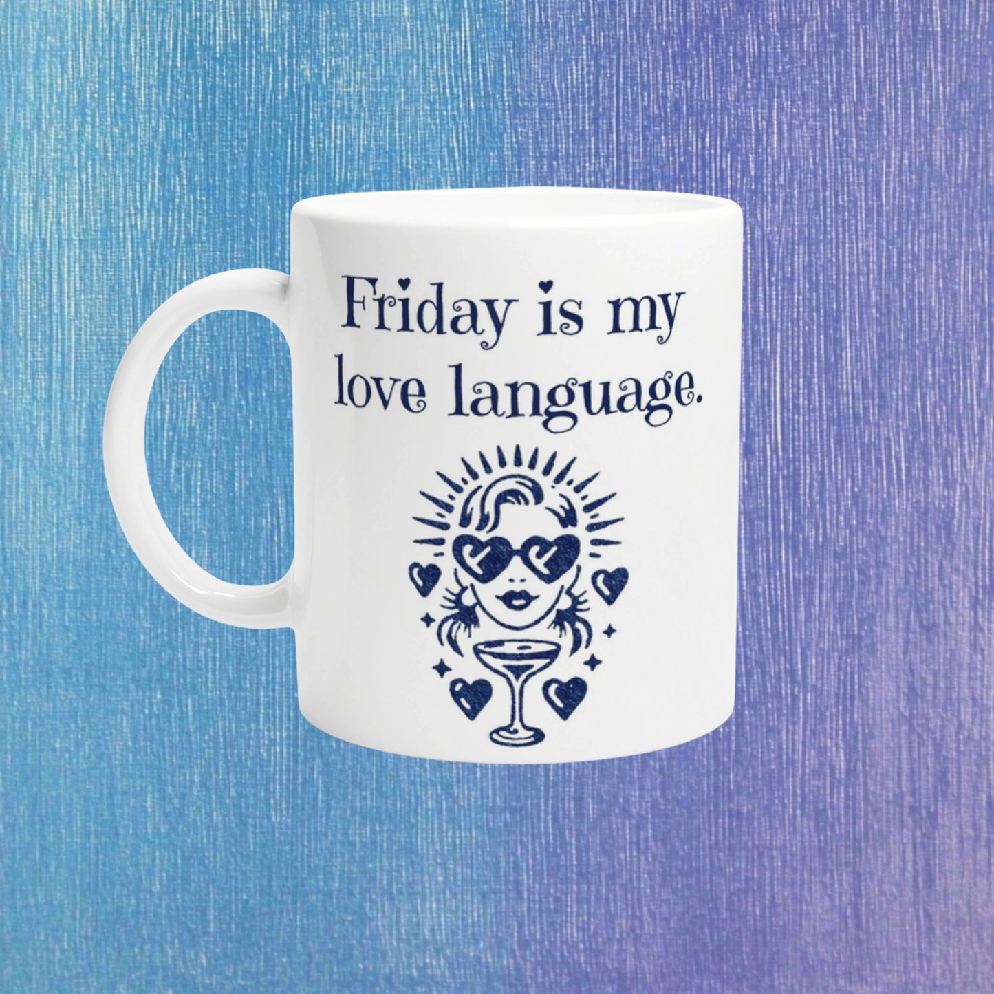 White mug with navy text Friday is my love language and a retro figure with heart sunglasses and a cocktail, on a blue background.