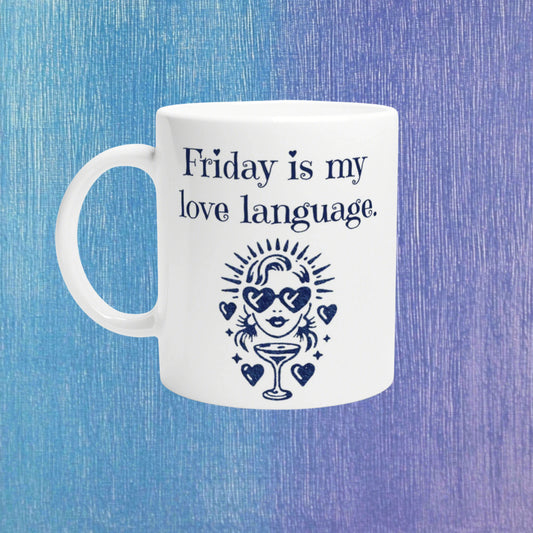 White mug with navy text Friday is my love language and a retro figure with heart sunglasses and a cocktail, on a blue background.