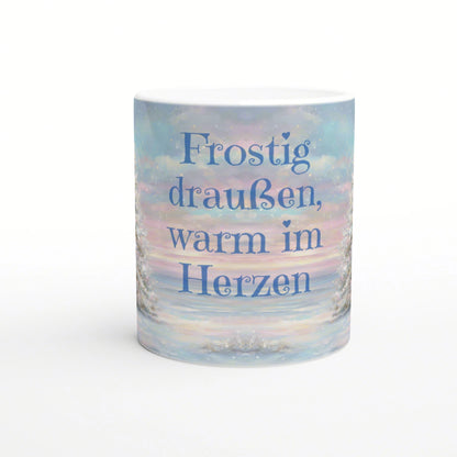 Pastel winter scene mug with the German text 'Frostig draußen, warm im Herzen'.
