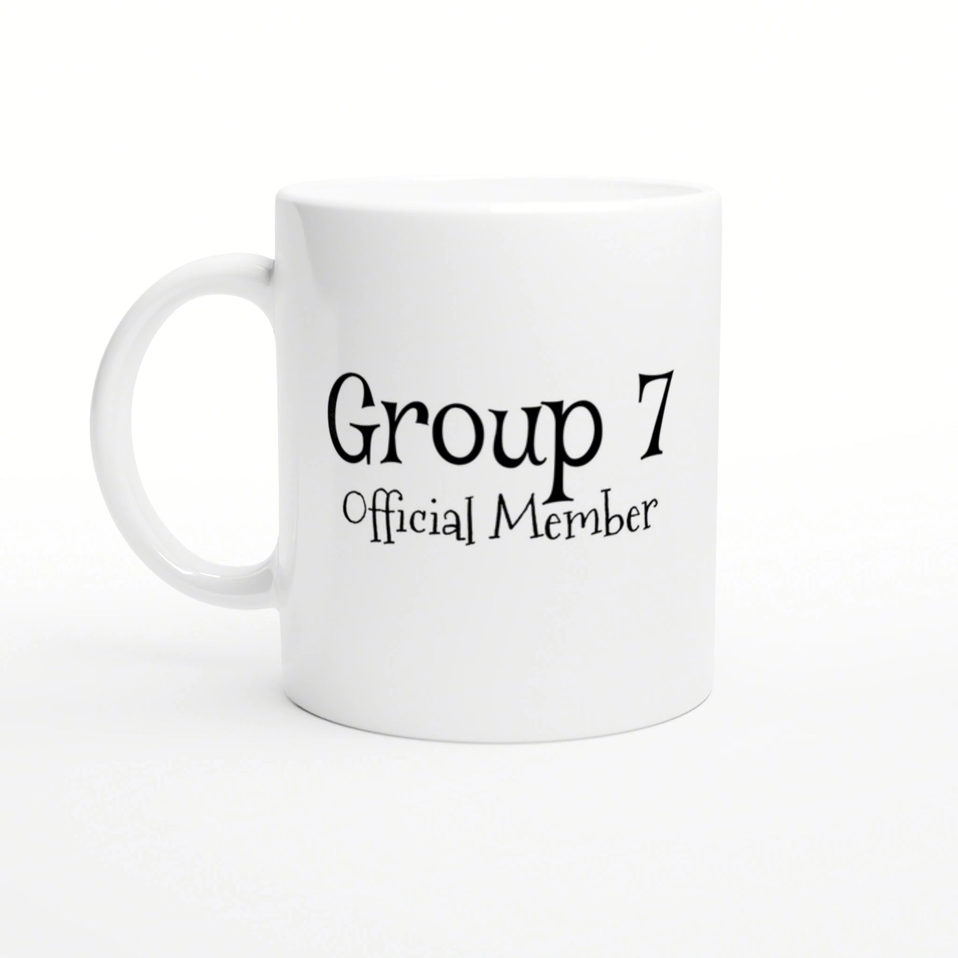 White ceramic mug displaying the text 'Group 7 Official Member' in decorative black font; product mockup.
