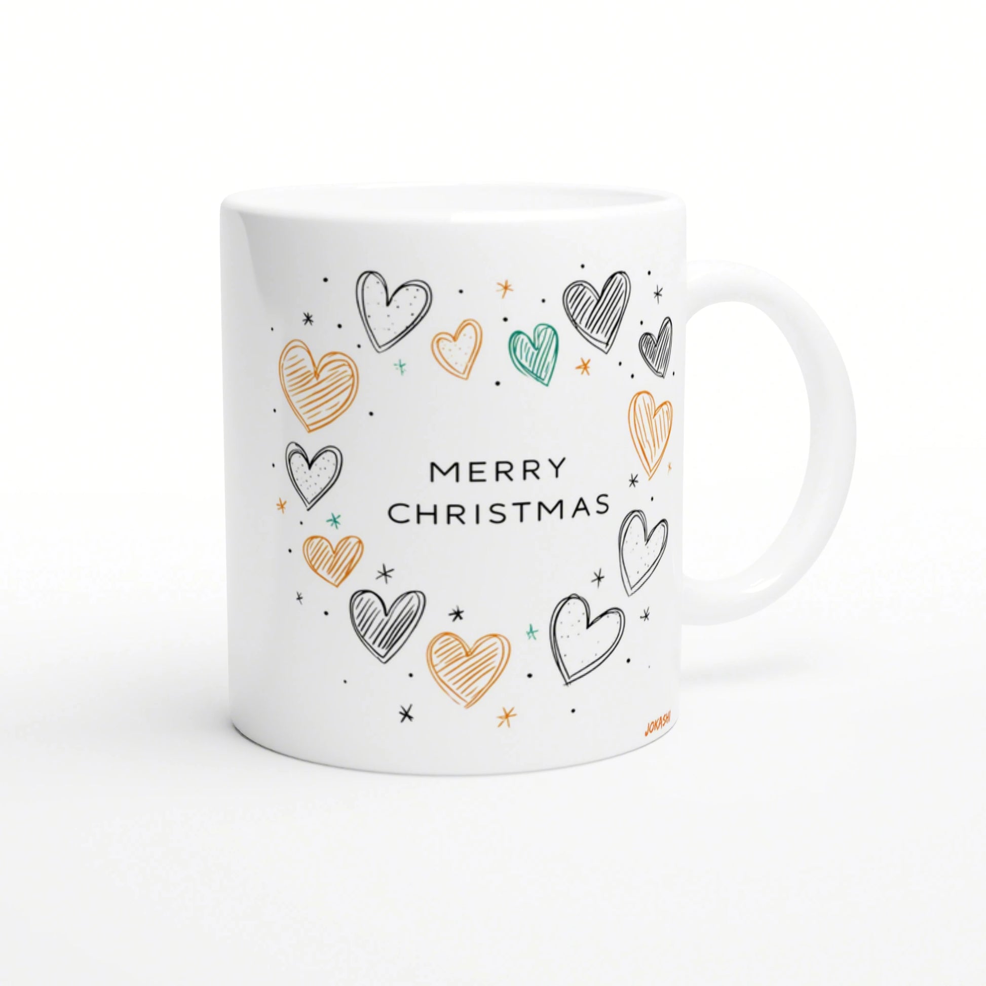 White mug mockup with 'MERRY CHRISTMAS' text surrounded by colorful hand-drawn hearts and stars in orange, teal, and black.