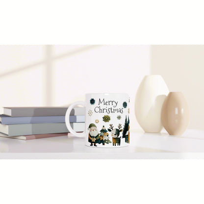 White mug with 'Merry Christmas' and festive woodland illustrations, shown beside books and decorative vases.