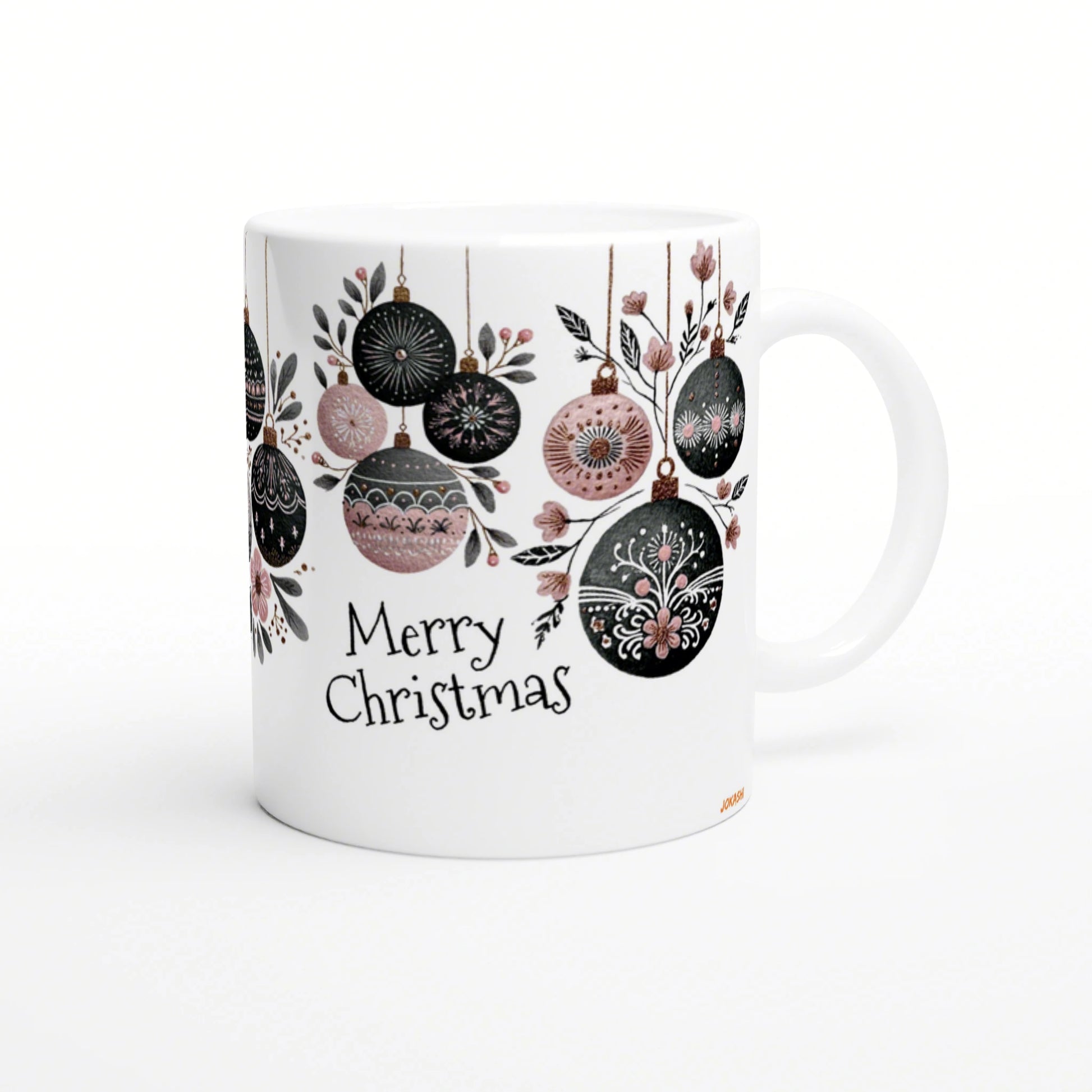 White ceramic mug featuring black and pink Christmas ornaments hanging from branches and the words 'Merry Christmas' in decorative handwriting; product mockup.