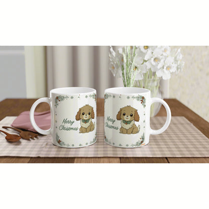 Two white mugs feature a cute brown puppy illustration and 'Merry Christmas' text, with a holiday floral border on a wooden table.