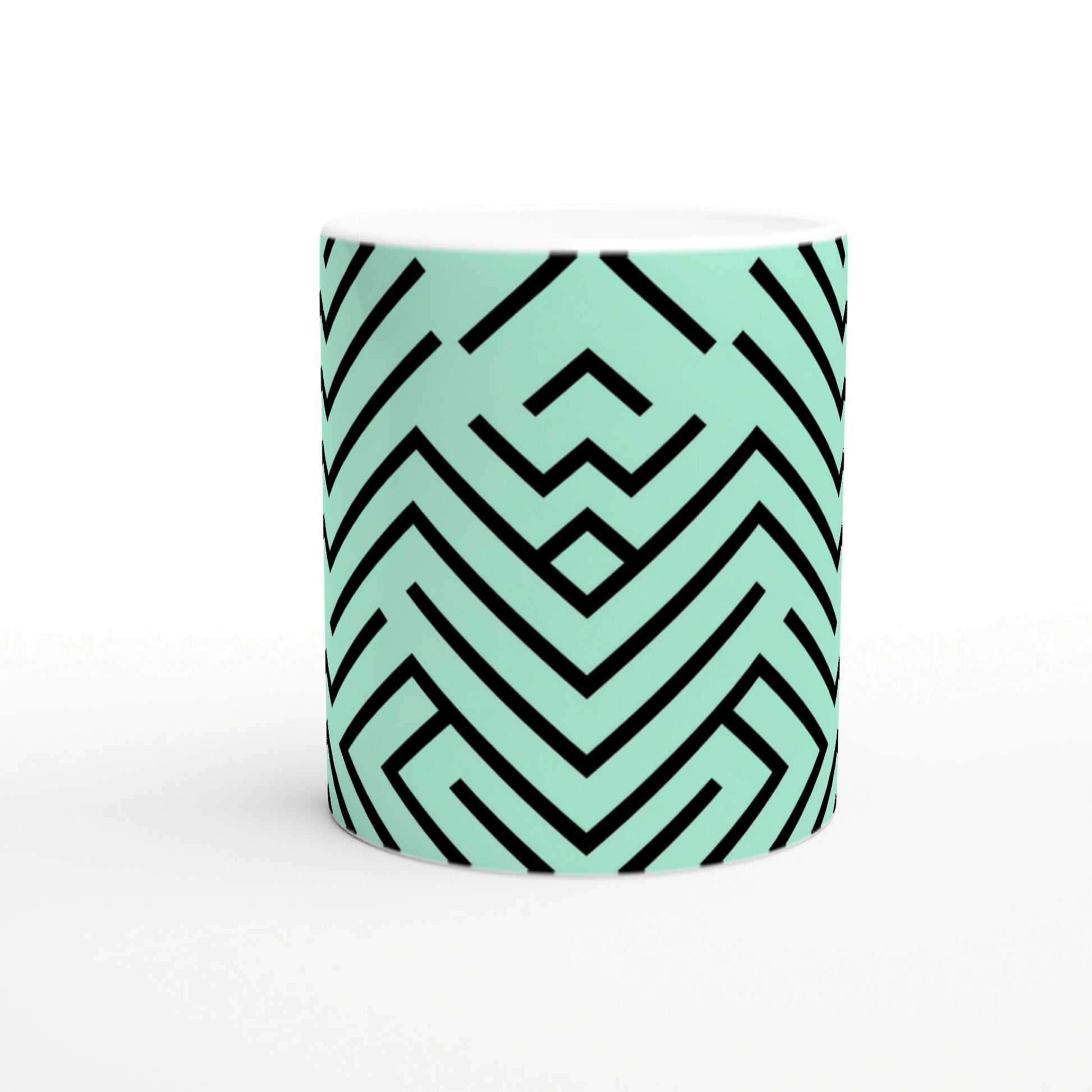 Mint-teal mug featuring a bold black chevron geometric pattern; product mockup for online shop.
