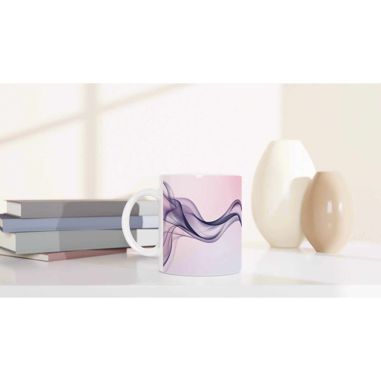 Mockup of a ceramic mug with lavender-purple abstract waves on a pink background, placed on a desk with books and vases