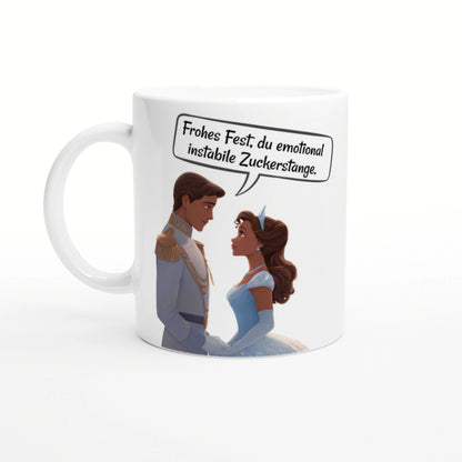 Mockup mug with a cartoon prince and princess; speech bubble reads a joke: Frohes Fest, du emotional instabile Zuckerstange