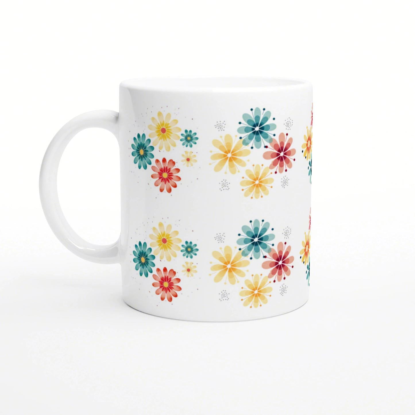 Product mockup: white ceramic mug adorned with scattered colorful flowers in yellow, teal, orange and red on a white background.