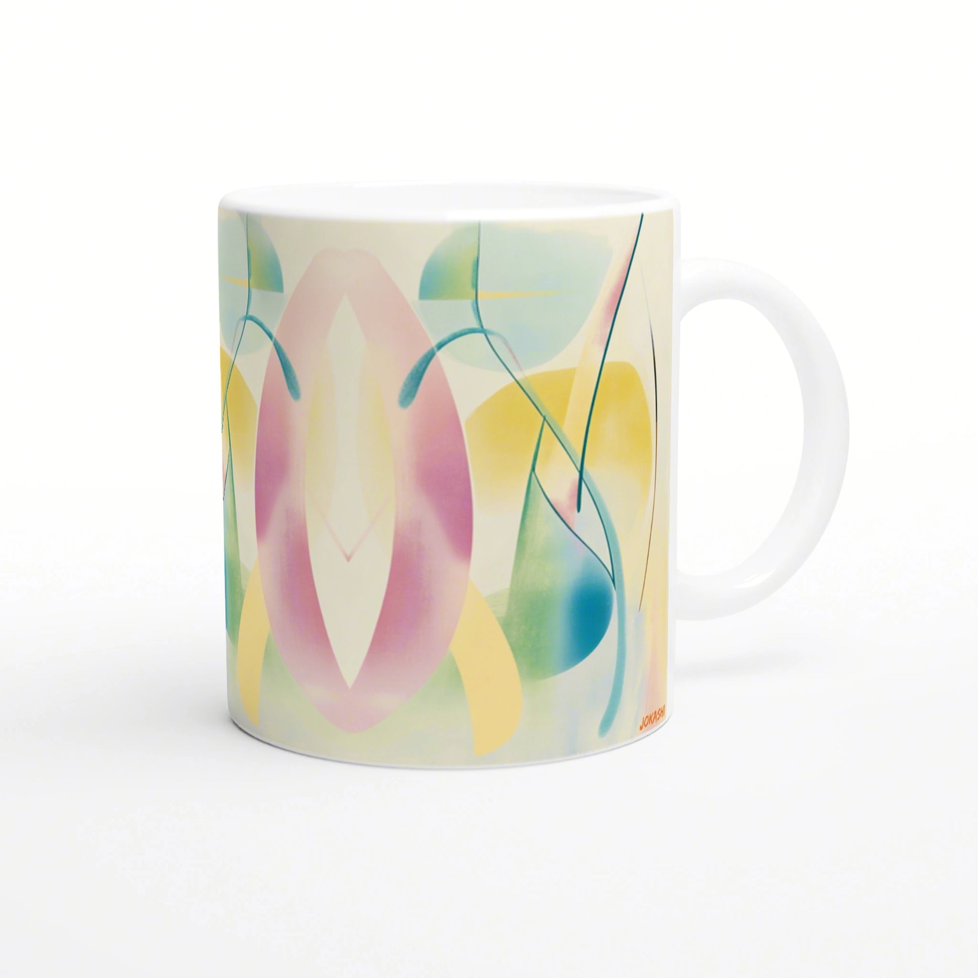 Mockup of a white ceramic mug with pastel abstract design—pink, yellow and teal shapes with flowing lines.