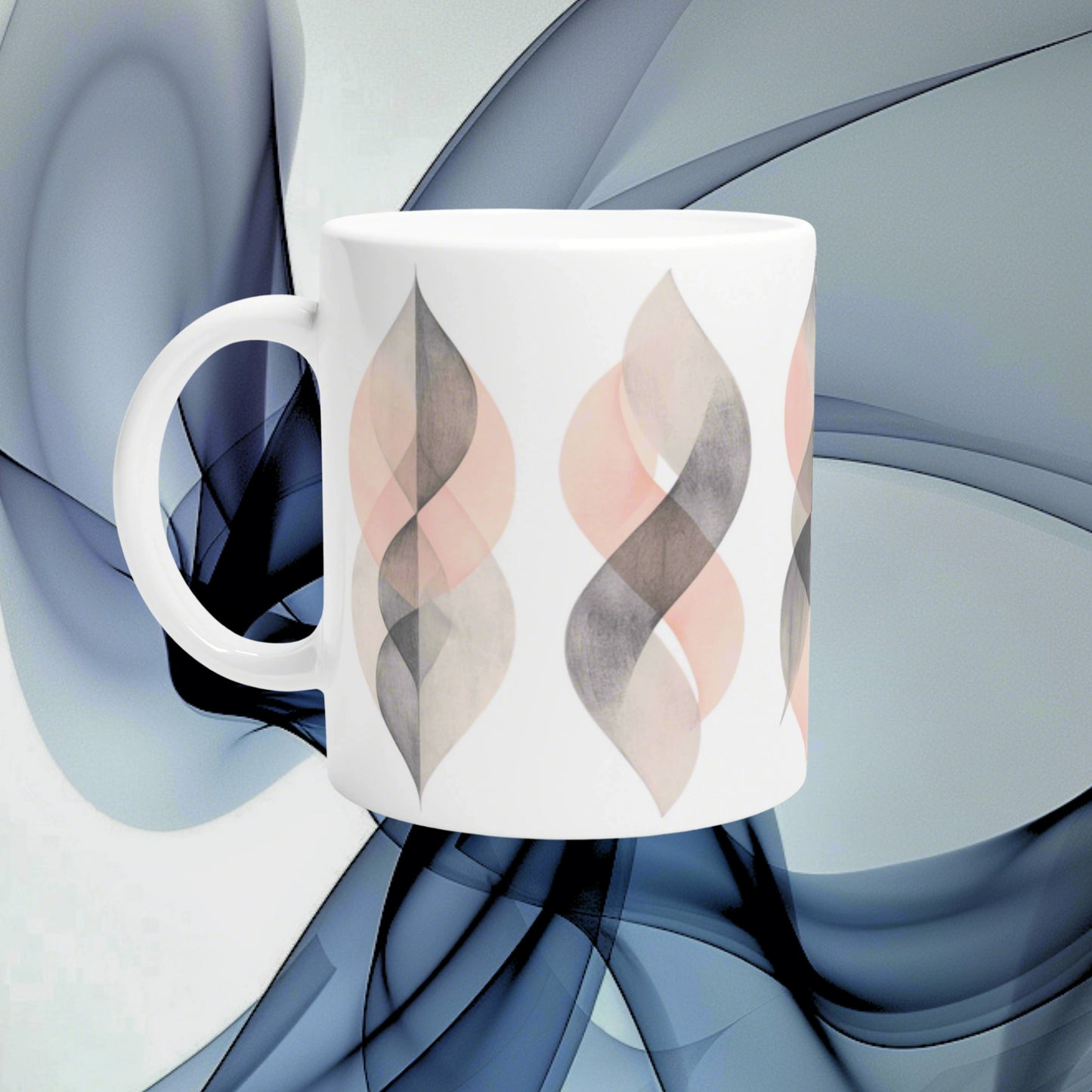 White ceramic mug with pastel leaf-shaped abstract pattern in pink and gray on a blue abstract background.