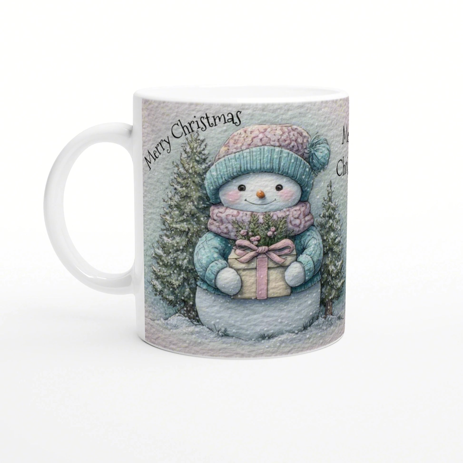 Mug with a cute snowman in teal hat and scarf holding a gift among snowy trees; Merry Christmas