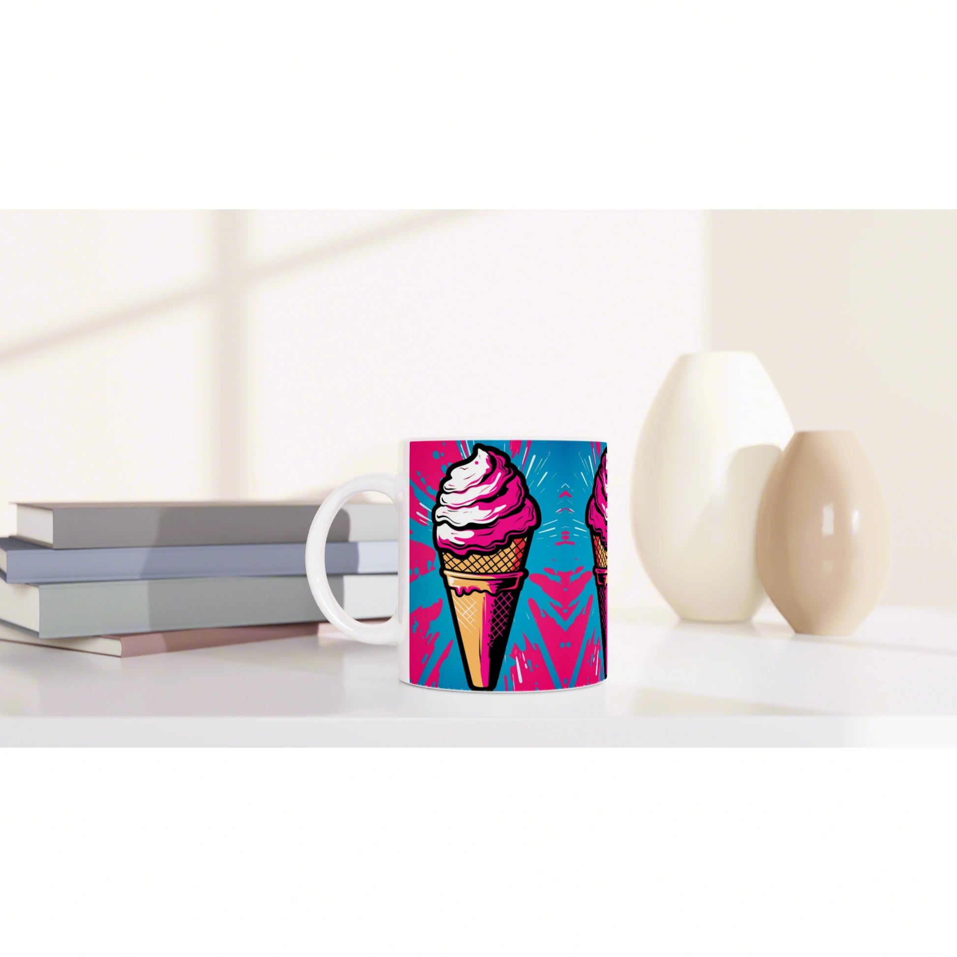 White mug featuring a bold pink ice-cream cone graphic on a blue background, placed on a shelf with books and ceramic vases.