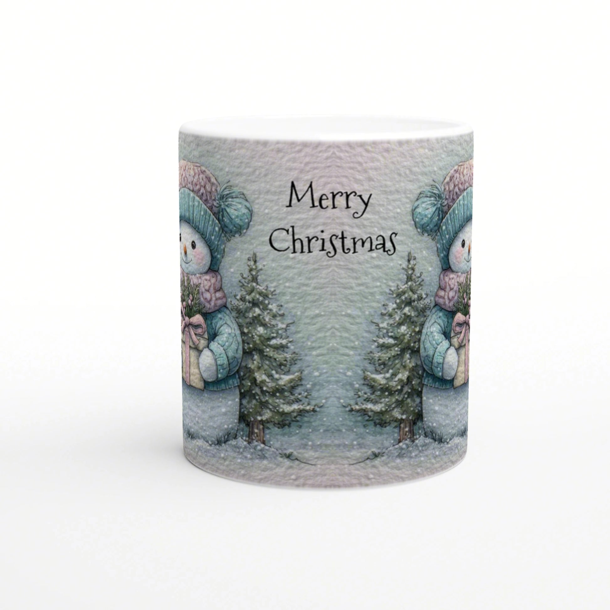 Mug mockup with 'Merry Christmas' text featuring a snowy winter scene: snowmen in teal hats, pine trees, and wrapped gifts.