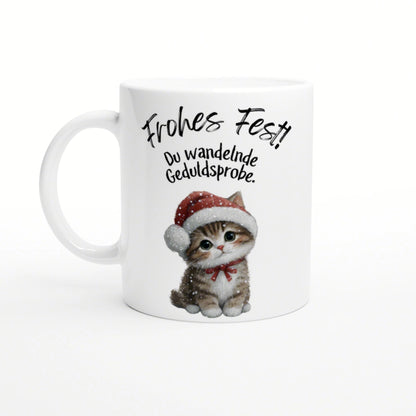 Mug mockup featuring a cute kitten in a Santa hat and the German caption 'Frohes Fest!! Du wandelnde Geduldsprobe'.