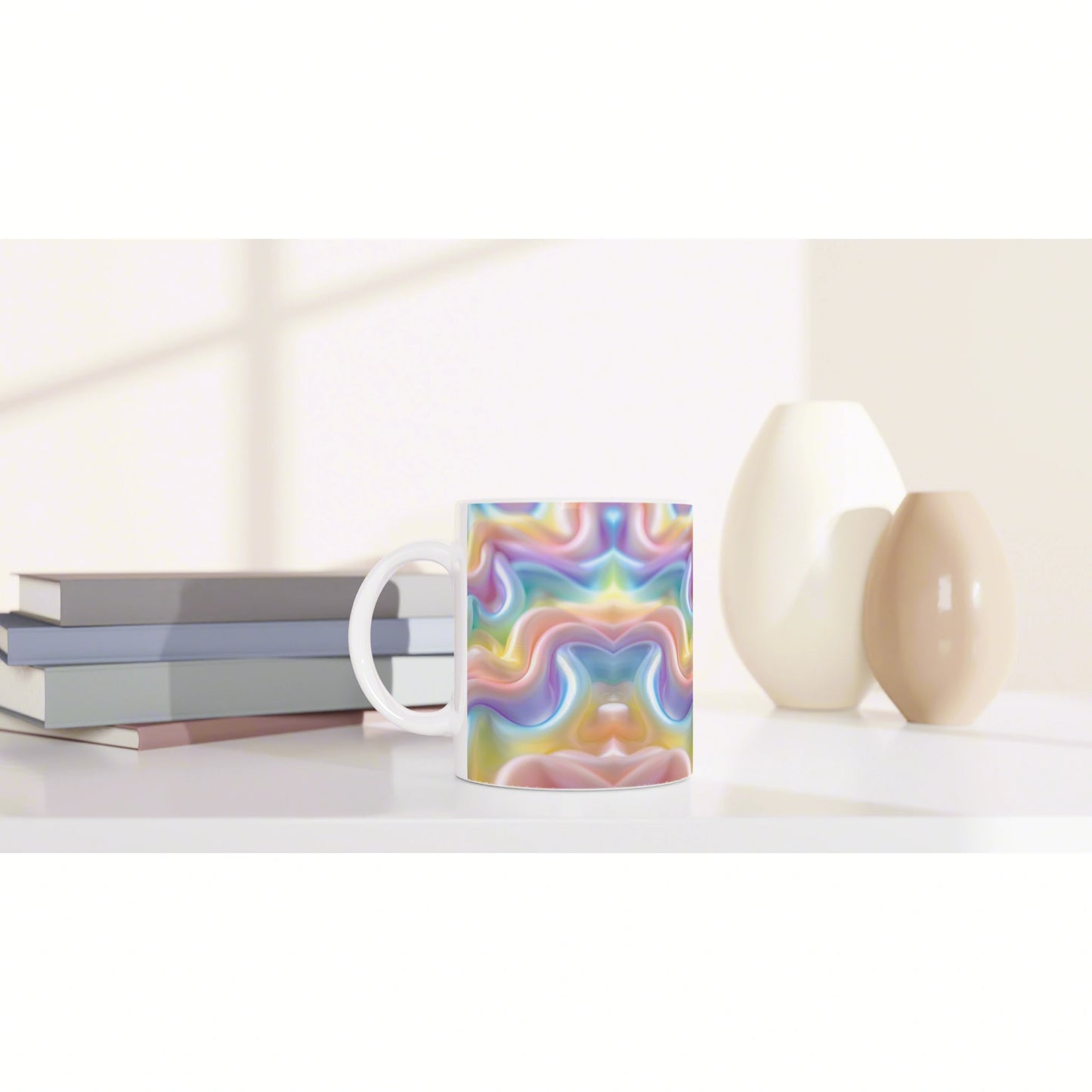 Product photo of a mug with a vibrant rainbow swirl pattern on a white table, with stacked books and cream ceramic vases nearby.