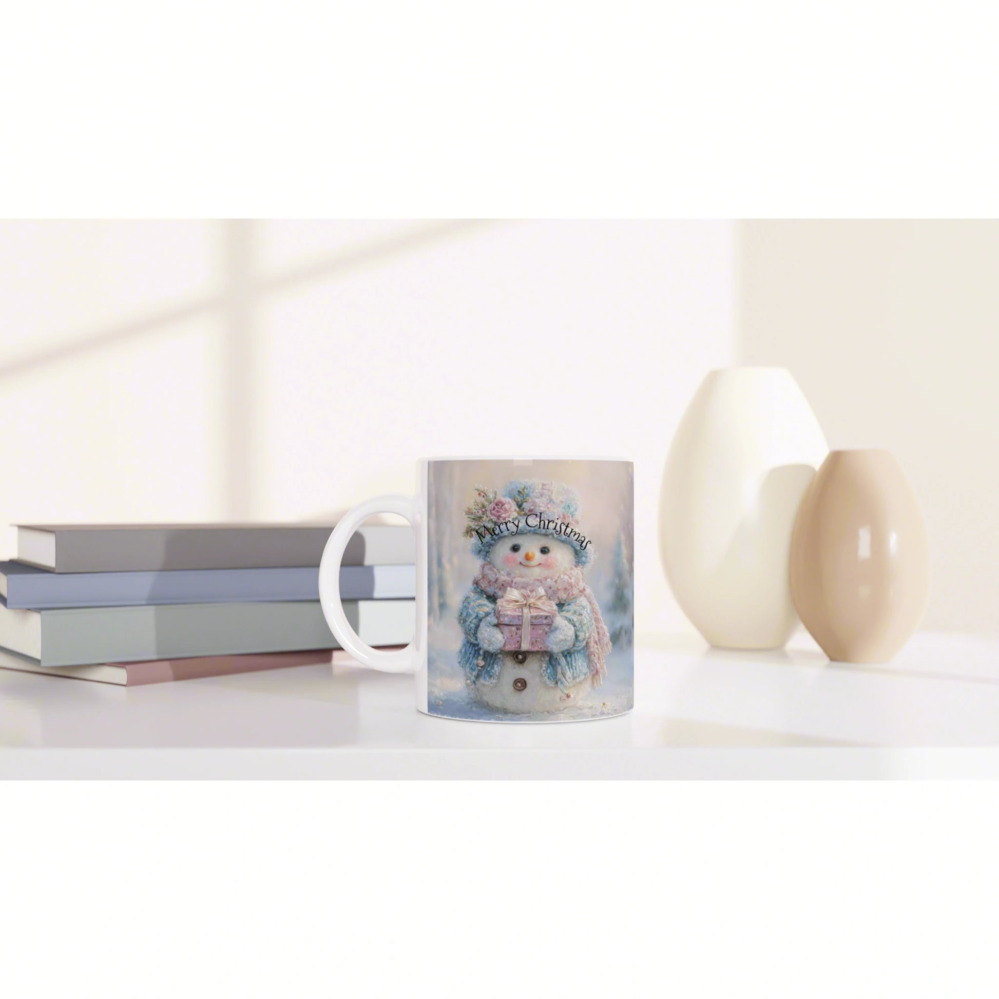 Mug featuring a snowy snowman and 'Merry Christmas' text, placed on a desk with books and decorative vases in soft lighting.