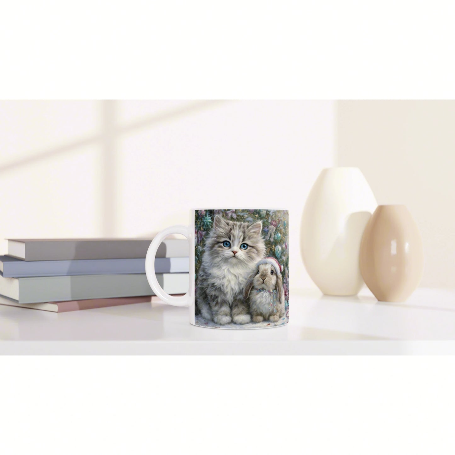 White ceramic mug with a colorful print of two fluffy animals in a garden scene, placed on a white desk with books and vases.