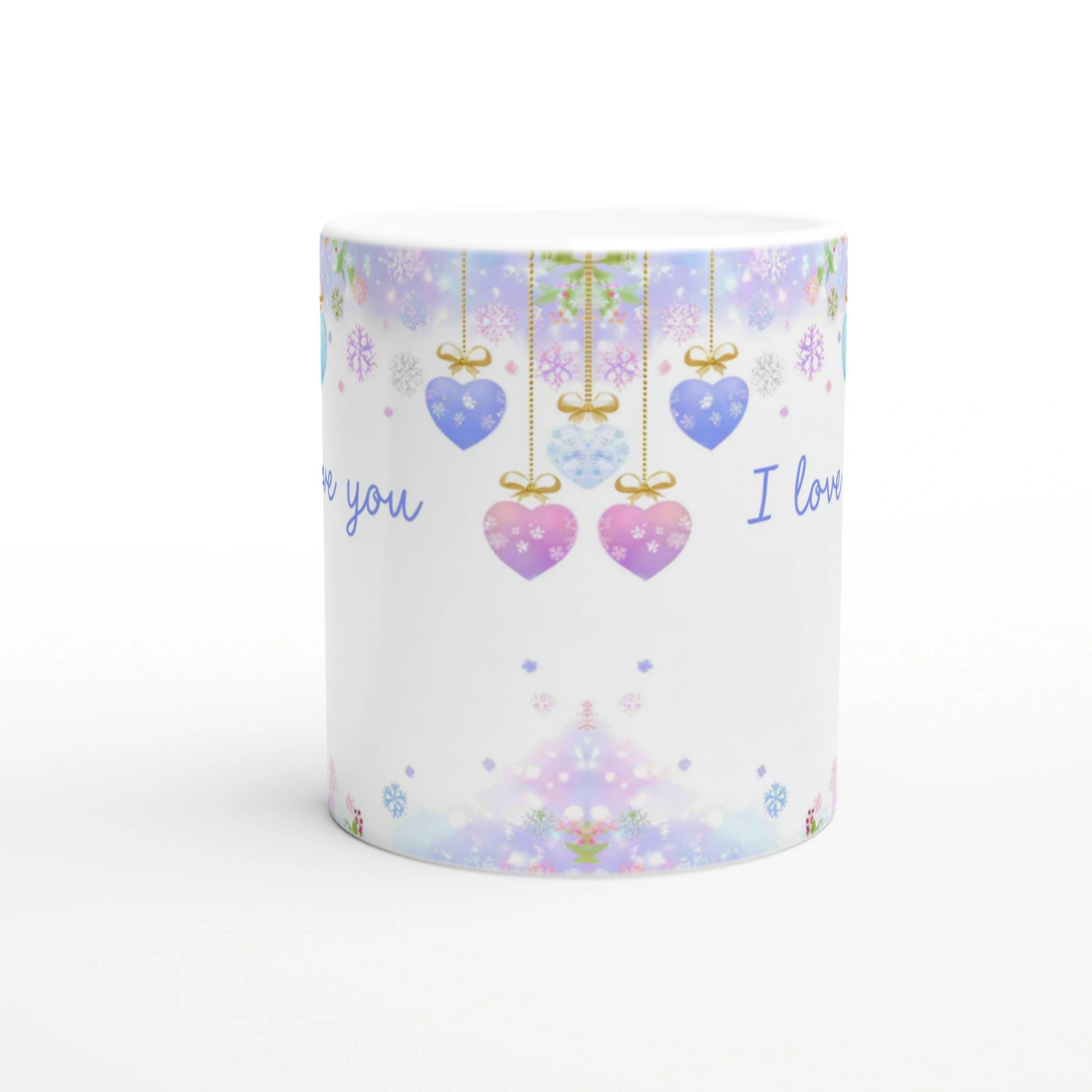 Product mug with pastel holiday pattern: hanging heart ornaments, snowflakes, and 'I love you' text on white background.