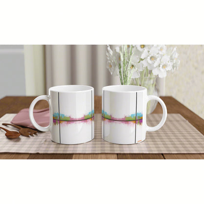 Product mockup: two white ceramic mugs with a colorful abstract stripe design, placed side by side on a wooden table.
