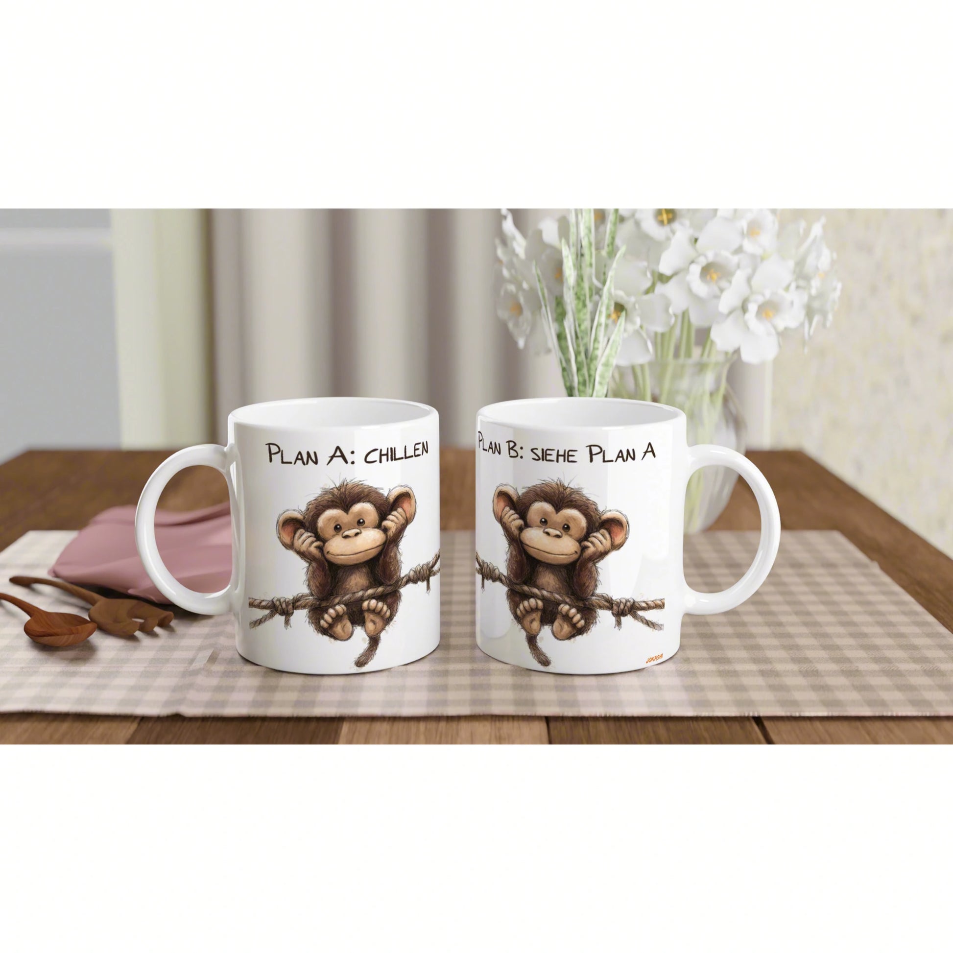 Product mockup: two white mugs with a cartoon monkey on a rope and text Plan A: Chillen / Plan B: Siehe Plan A.