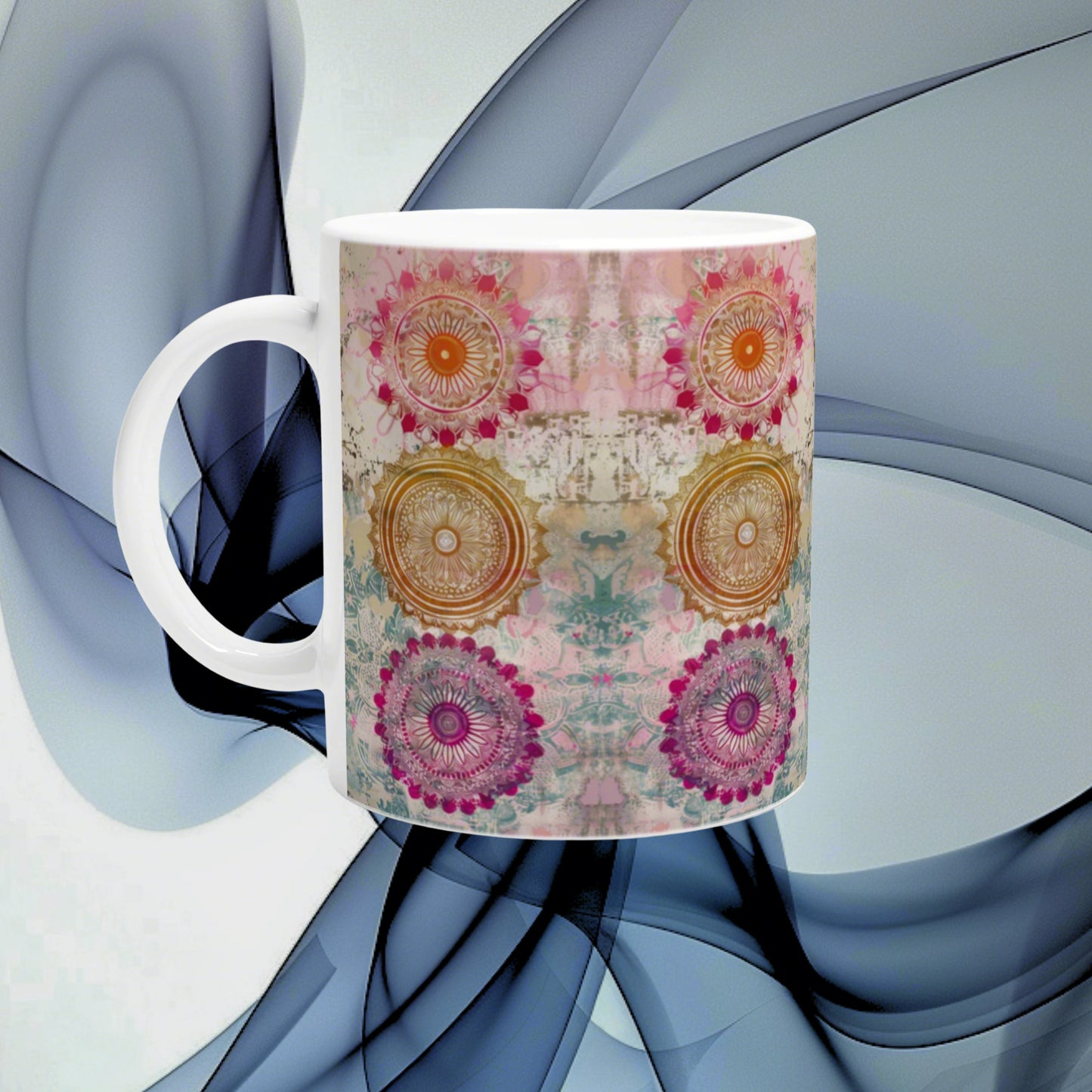 Product mockup: white ceramic mug with colorful mandala designs around the wrap on an abstract blue background.