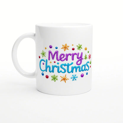 Product mockup: white ceramic mug with colorful 'Merry Christmas' lettering and multicolored snowflakes around it.