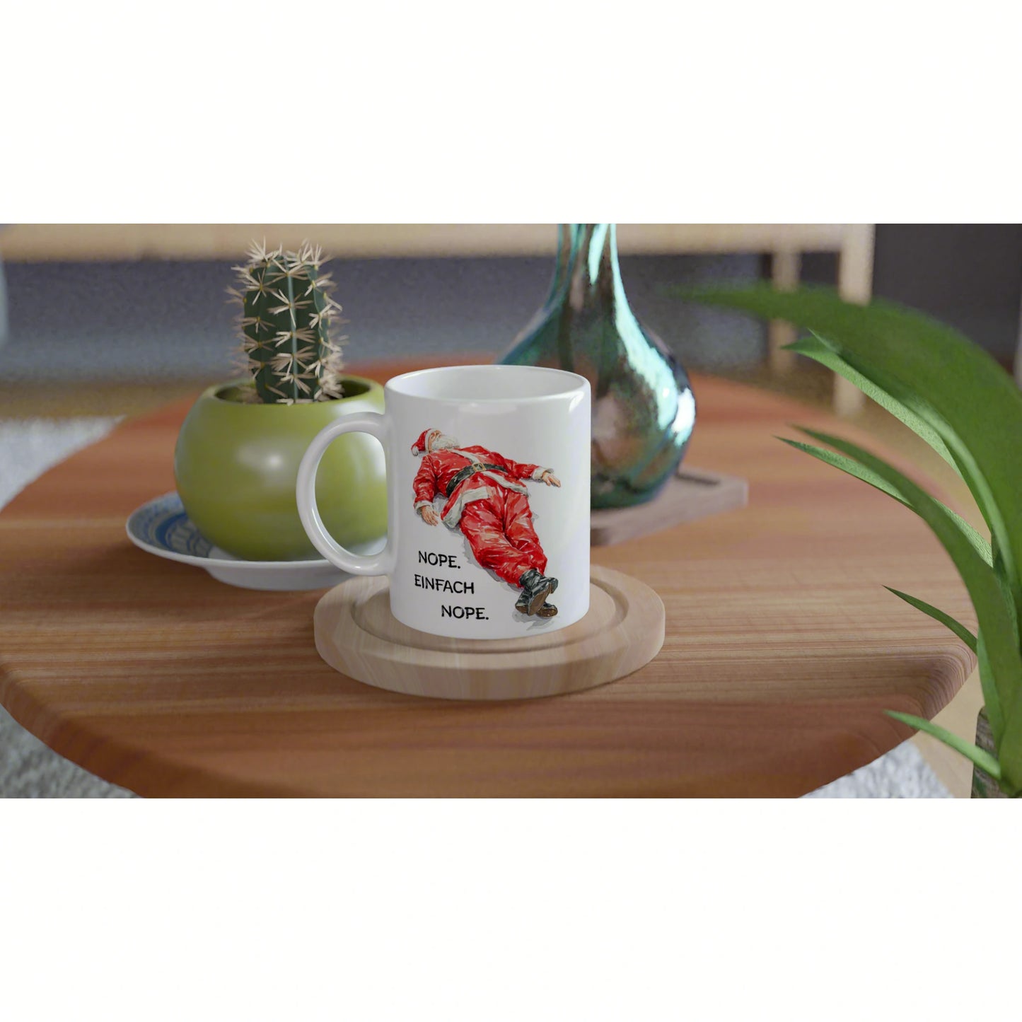 Product mockup: white mug on a wooden table featuring a red Santa illustration and the German text NOPE. EINFACH NOPE.