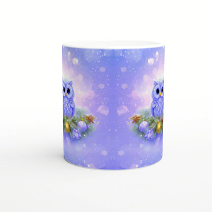Purple mug mockup with a symmetric winter scene: two blue owls among pine branches and ornaments, with falling snow.